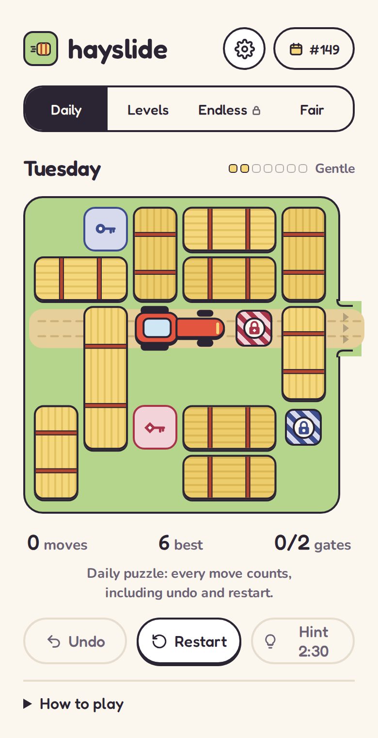 A Hayslide puzzle: hay bales on a green field around a red tractor, with keys and locked gates.